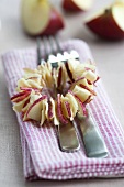 A wreath of dried apple slices used to decorate a serviette