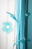 Close-up of turquoise fairy lights