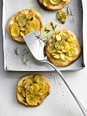 Potato pizzette with rosemary and garlic