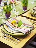 A place setting at a table laid for Easter