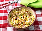 Pasta salad with sausages and peas