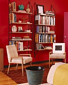 Interior with 70s shelves mounted on bright red walls and 50-style chairs