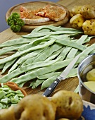 Sword beans on wooden table