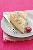 Cheesecake with white chocolate flakes and a rose