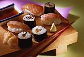 A plate of sushi: nigiri, maki, ginger, wasabi and soya sauce