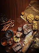 An arrangement of wooden moulds, cutters, Spekulatius (German Christmas shortcrust biscuits) and dough