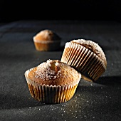Sugared muffins in paper cases
