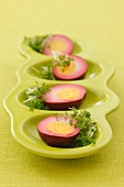 Boiled eggs marinated in beetroot juice
