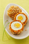 Boiled eggs in almond and carrot crust