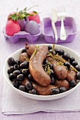 Sausages with black olives