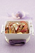 Sausages with apple slices, onions and marjoram