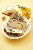 Pork loin stuffed with eggs and peas