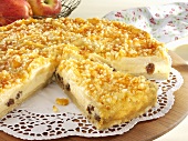 Cheesecake with apples and raisins, a piece cut