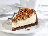 Piece of cheesecake with nuts