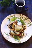 Aubergine rolls with basil