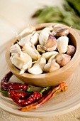 Garlic in small bowl and dried chillies