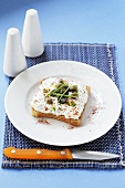 Cottage cheese, capers and olives on toast