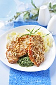 Chicken breast with sesame seeds on ribbon pasta