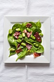 Spinach salad with Serrano ham and fresh broad beans