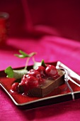Chocolate dessert with cherry sauce