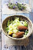 Mushroom croquettes with potatoes and lettuce