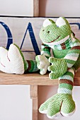 Knitted froggy decorating child's bedroom