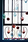 Heart-shaped decorations by a window