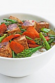 Fried tofu cubes and vegetables on rice