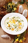 Fried eggs with cream and herbs for Easter