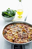 Spanish omelette in a frying pan