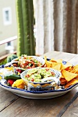 Guacamole and tomato salsa with nachos