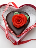 Chocolate heart with marzipan rose to give as a gift