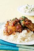 Spicy chicken with tomato relish on couscous