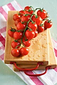 Cherry tomatoes on wooden board