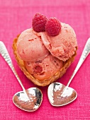 Raspberry ice cream in heart-shaped wafer bowl
