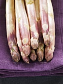 White asparagus on purple cloth
