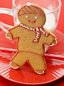 Gingerbread man in front of glass of milk