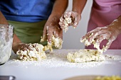 Children kneading dough