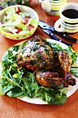 Roasted Game Hen with Wild Flowers and Rosemary in Pan