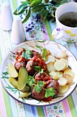 Meatballs with fried potatoes and gherkins