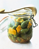 Pickled green olives in a preserving jar