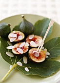 Halved figs with honey and flaked almonds