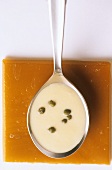A spoonful of horseradish sauce with capers