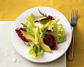 Mixed salad leaves with avocado wedges