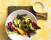 Salad leaves with fried vegetables and aioli