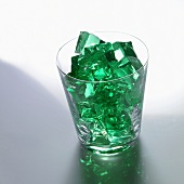 Green jelly cubes in a glass
