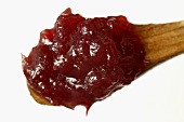 Redcurrant jelly on a wooden spoon