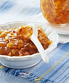 Nectarine and pineapple jam in a small bowl