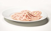 Bierschinken (ham sausage) on a plate, sliced