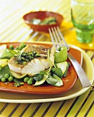 Fillet of cod with herb pesto on green vegetables
